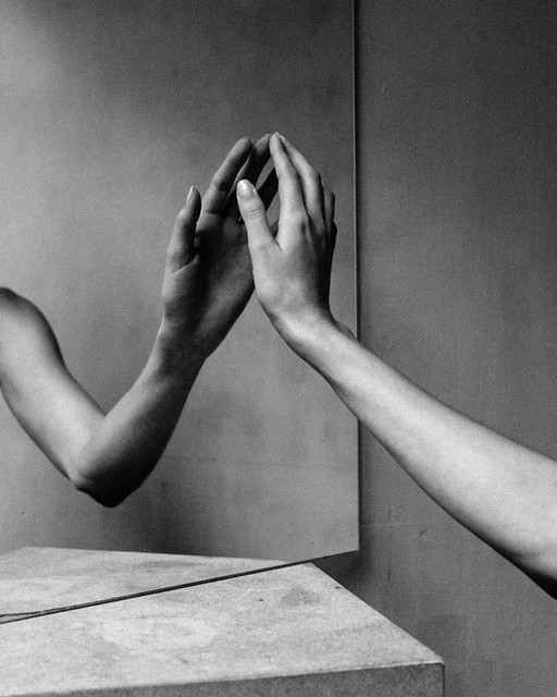 Black and white photograph of two hands
